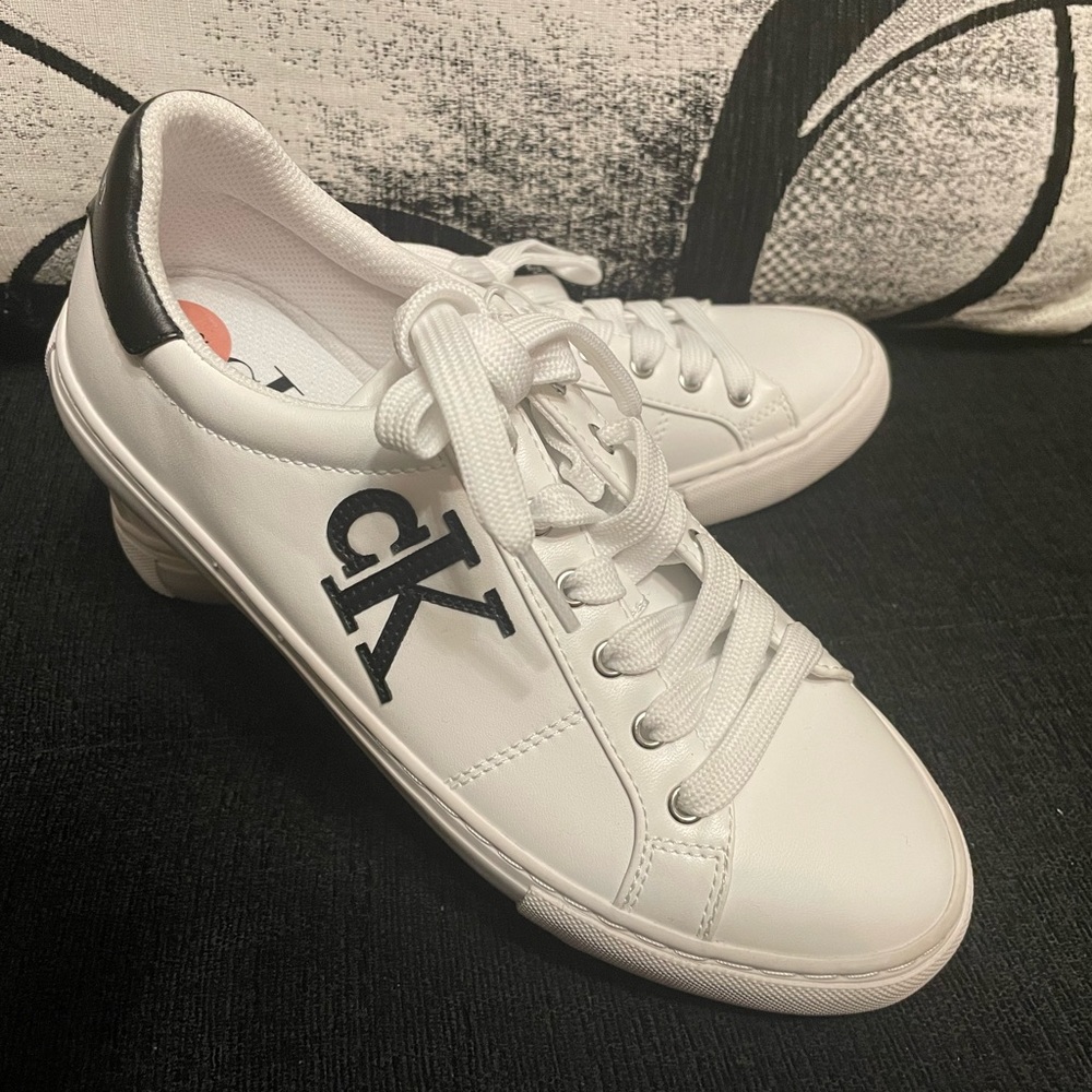 NEW Calvin Klein sneakers.I’m selling them because they are big on me.